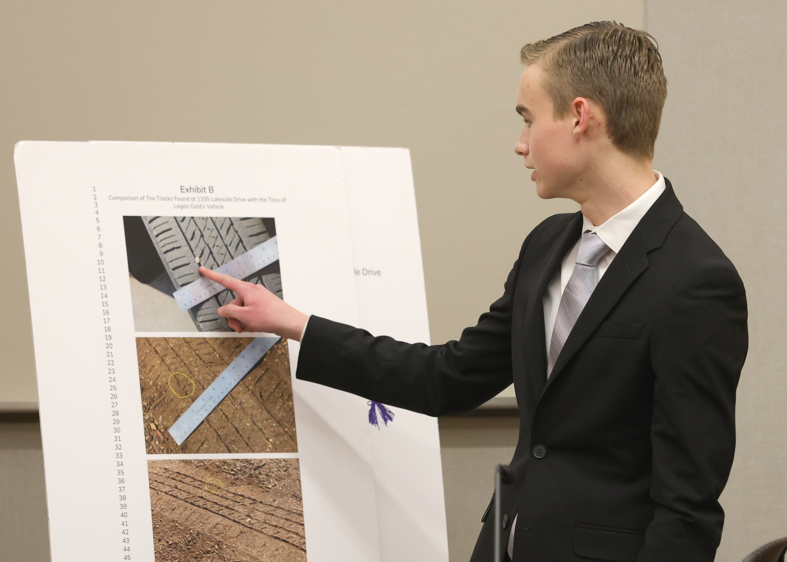 Mock Trial competition student with exhibits